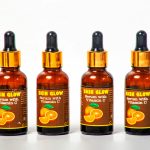 Four Vitamin C serum bottles arranged on a white background for skincare.
